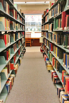 Photo of the book stacks at the Lloyd Sealy Library