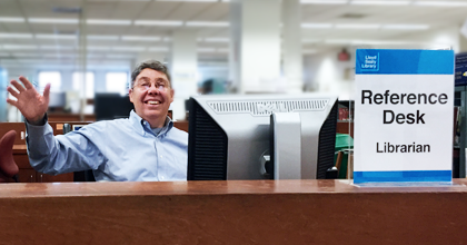 Photograph of Jeffrey Kroessler at the reference desk