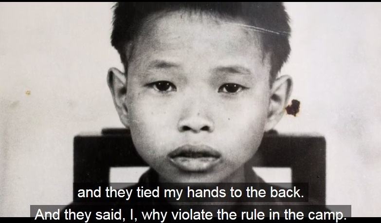 A young boy with the caption, "and they tied my hands to the back. And they said, I, why violate the rule in the camp."