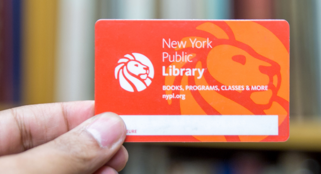 Hand holding New York Public Library card