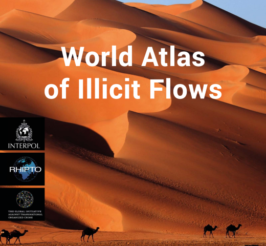 Cover: World Atlas of Illicit Flows, set against a background of sand dunes and camels