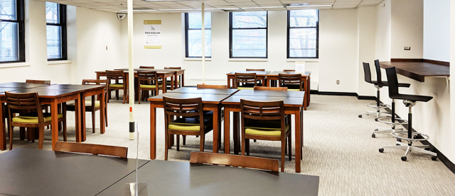 Bright room filled with desks and chairs