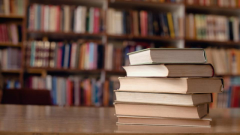 Library books Books stacked on table in library